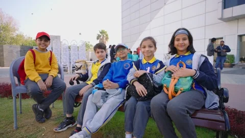 Pakistani students smiling, sitting outdoors, promoting inclusive education and Stock Footage 333005909