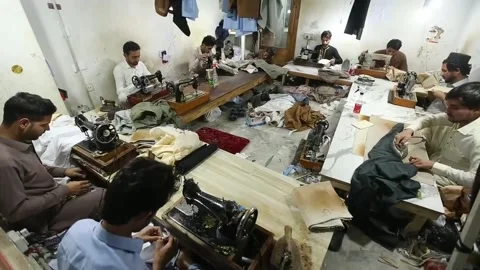 Pakistani tailors prepare for Eid al-Fitr celebrations, PAKISTÁN, PK - 24 Mar 20 Stock Footage 304878436