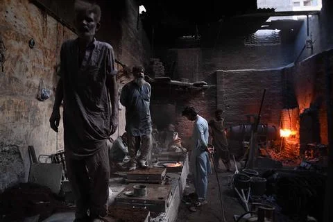 Pakistani workers at an iron die-casting factory in Karachi, Pakistan - 10 Sep 2 Stock Photos