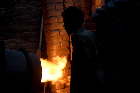 Pakistani workers at an iron die-casting factory in Karachi, Pakistan - 10 Sep 2 Stock Photos