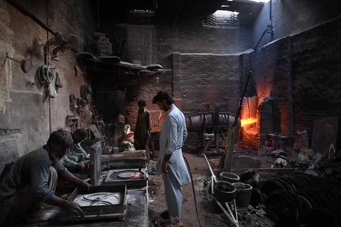 Pakistani workers at an iron die-casting factory in Karachi, Pakistan - 10 Sep 2 Stock Photos