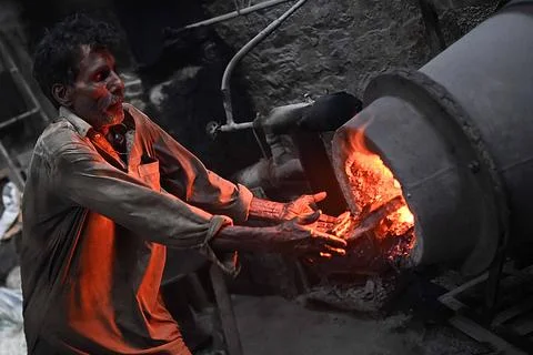 Pakistani workers at an iron die-casting factory in Karachi, Pakistan - 10 Sep 2 Stock Photos