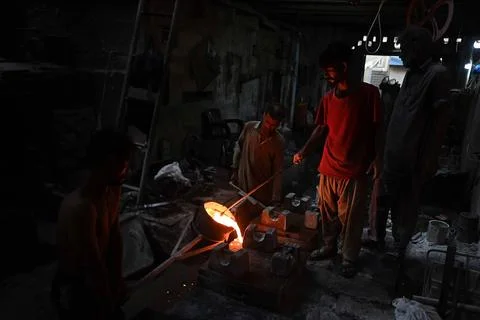 Pakistani workers at an iron die-casting factory in Karachi, Pakistan - 10 Sep 2 Stock Photos