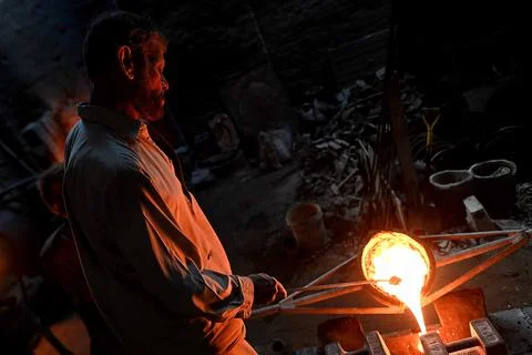 Pakistani workers at an iron die-casting factory in Karachi, Pakistan - 10 Sep 2 Stock Photos