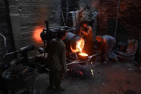 Pakistani workers at an iron die-casting factory in Karachi, Pakistan - 10 Sep 2 Stock Photos