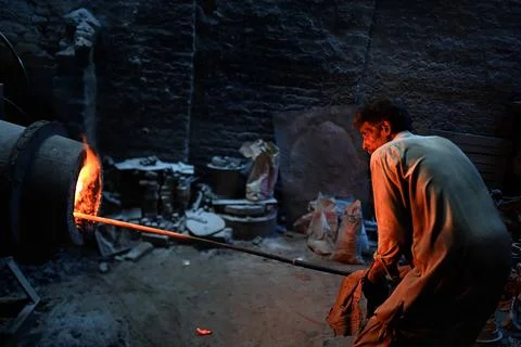 Pakistani workers at an iron die-casting factory in Karachi, Pakistan - 10 Sep 2 Stock Photos