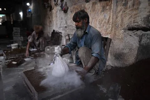 Pakistani workers at an iron die-casting factory in Karachi, Pakistan - 10 Sep 2 Stock Photos
