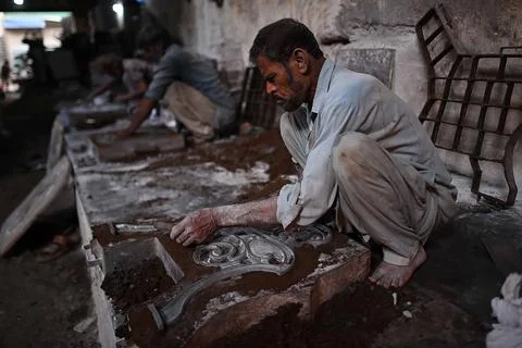 Pakistani workers at an iron die-casting factory in Karachi, Pakistan - 10 Sep 2 Stock Photos