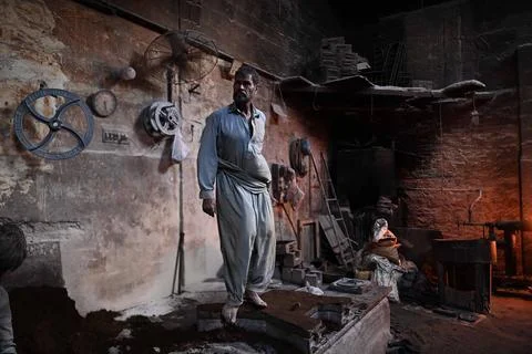 Pakistani workers at an iron die-casting factory in Karachi, Pakistan - 10 Sep 2 Stock Photos