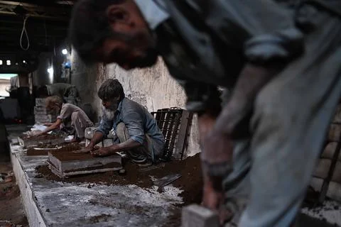 Pakistani workers at an iron die-casting factory in Karachi, Pakistan - 10 Sep 2 Stock Photos