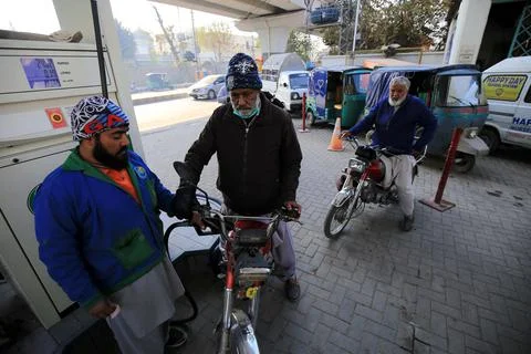 Pakistan's government decrease petrol price by Rs 5 per liter (0.028 USD), Pesha Stock Photos