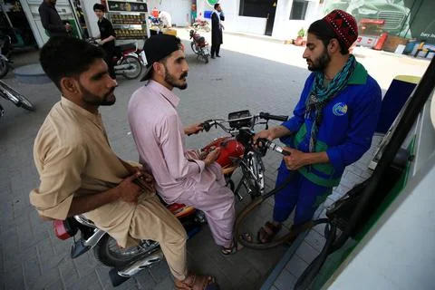 Pakistan's government decrease petrol price by Rs 12 per liter (0.042 USD), Pesh Stock Photos