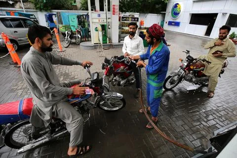 Pakistan's government decrease petrol price by Rs 8 (0.028 USD) per liter, Pesha Stock Photos