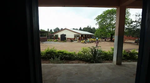 PAKRO MORNING ASSEMBLY: PAN FROM EMPTY CLASSROOM Stock Footage 59735068