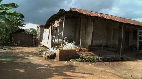 PAKRO: A PILE OF EMPTY SACHET WATER PACKETS AND AN EMPTY BUILDING Stock Footage 58106846