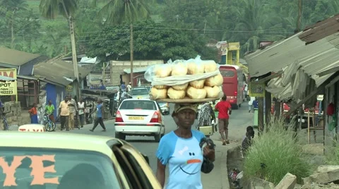 PAKRO STREET- BREAD SELLER AND WOMAN EXITING TAXI Stock Footage 59734853