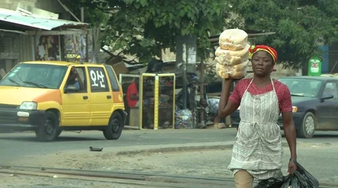 PAKRO STREET- FEMALE VENDOR CARRIES BREAD Stock Footage 59735083