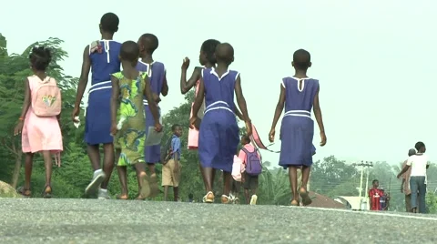PAKRO STUDENTS IN BLUE WALK DOWN STREET Stock Footage 58930586