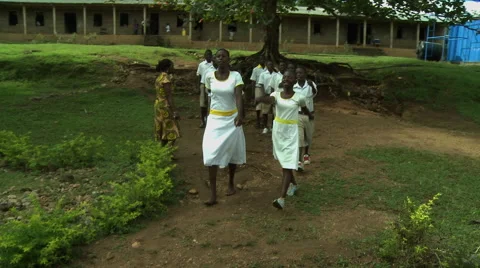 PAKRO STUDENTS MARCH INTO CLASSROOM Stock Footage 58057413