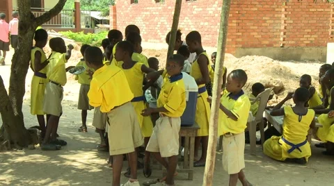PAKRO STUDENTS IN YELLOW AT LUNCH Stock Footage 58930560