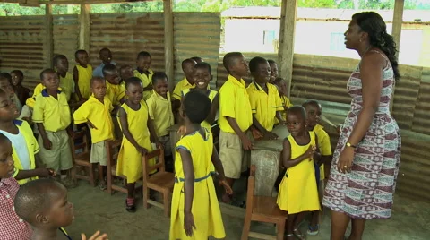 PAKRO: YOUNG STUDENTS AND TWO TEACHERS SING AND DANCE Stock Footage 58107535