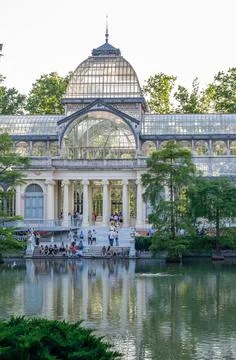 Palacio de Cristal, a metal and glass structure in Retiro Park, Madrid, Spain Stock Photos