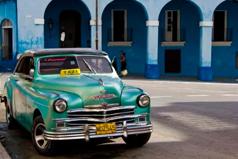 Palacio de Junco and a typical Cuban taxi, Matanzas, Cuba. Palacio de Junco,  Stock Photos