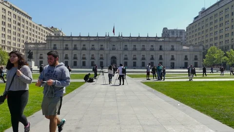 Palacio de La Moneda. People walk by the Executive branch palace Stock Footage 98090714