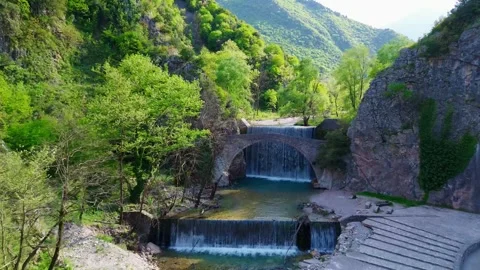 Palaiokaria Stone Bridge and Waterfall Greece Aerial Drone Footage Stock Footage 335839733