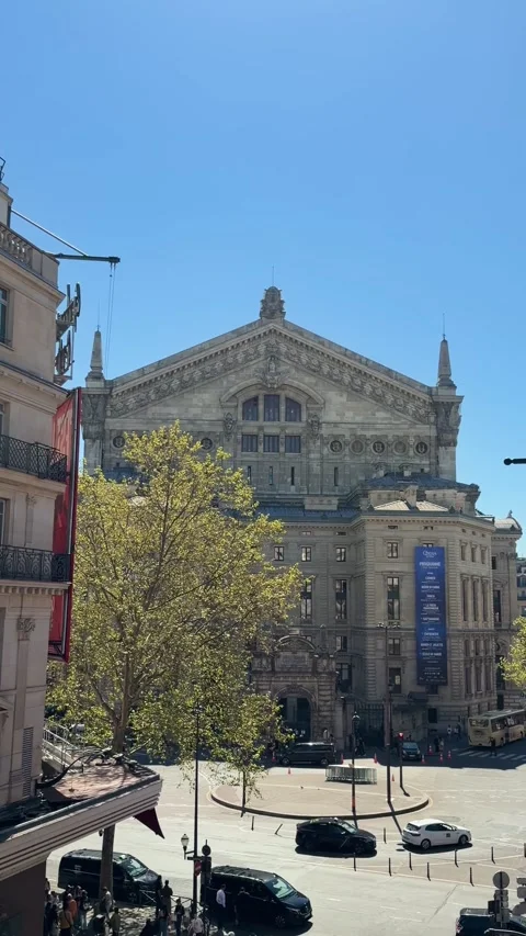 Palais Garnier facade with traffic on Rue de Mogador in Paris Stock Footage 337783206