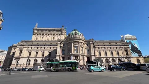 Palais Garnier opera house facade and Paris city traffic Stock Footage 337783395