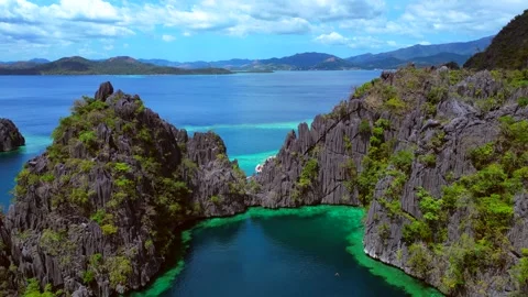Palawan limestone karsts and clear turquoise water. Magic aerial view drone Stock Footage 344602039