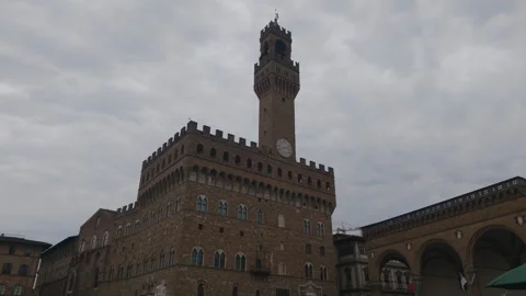 Palazzo Vecchio Clock Tower Under Dramatic Cloudy Sky in Florence Italy Stock Footage 340747453