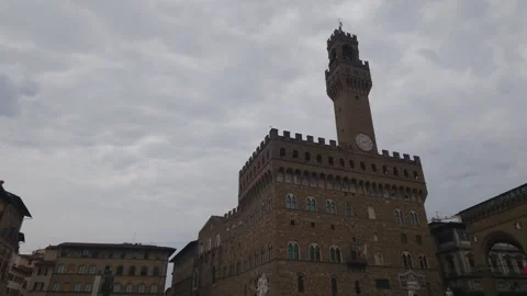 Palazzo Vecchio Clock Tower Under Dramatic Cloudy Sky in Florence Italy Stock-Footage 340747461
