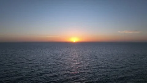 Pale Blue Calm Sunset Over Ocean Breeze – Tranquil Drone Footage Stock Footage 309945692
