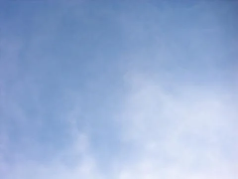 Pale Cloud Veil and Diffused Light in a Blue Sky Stock Photos