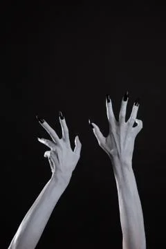 Pale ghost hands with sharp black nails, body art 스톡 사진