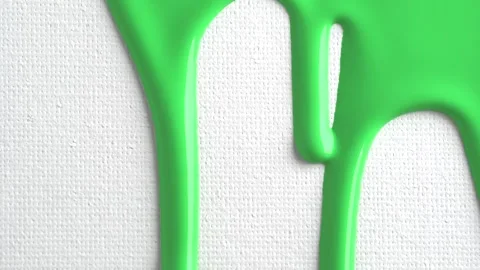 Pale green liquid drops of paint color flow down on white canvas. Abstract .. Stock Footage 249658609