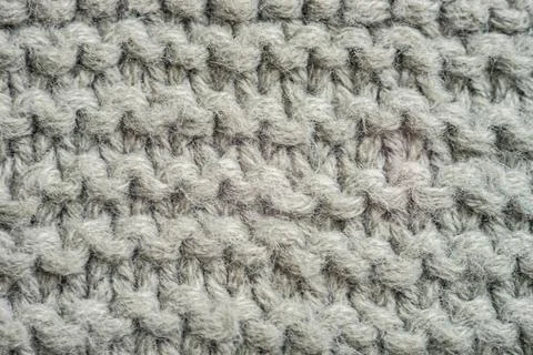 Pale grey background of knitted thread pattern Stockfoto's