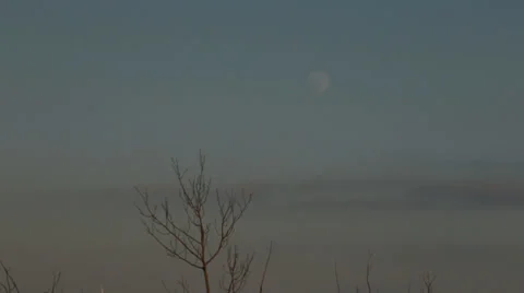 Pale moon in evening sky Stock Footage 37232273