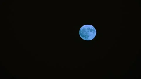 A Pale Moon Glows Softly In The Night Stock Footage 338410147