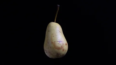 Pale pear rotating on black background, isolated studio shot. Stock Footage 117979836