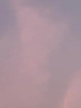 Pale Pink and Blue Cloudscape at Twilight Stockfoto's