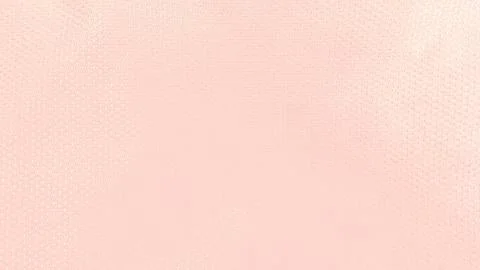 Pale pink fabric texture creates a soft minimalist background with fine woven 스톡 사진