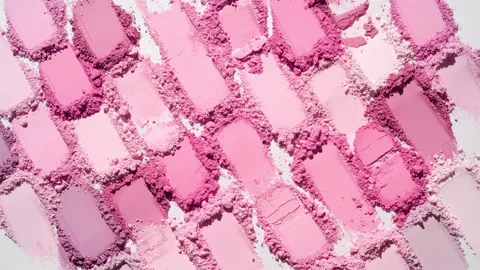Pale to pink powder heaps for blush promotion Stock Footage 338350540