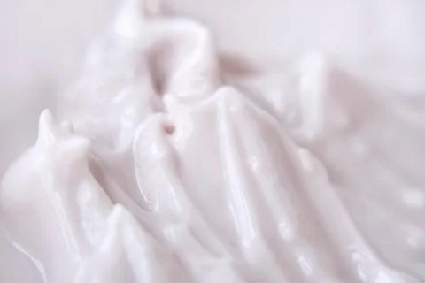 Pale pink yogurt delicate texture of fermented milk product Stock Photos
