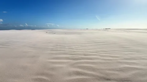 Pale Rippling Sand Flats Beneath a Blue Horizon at Lençóis Maranhenses Stock-Footage 342446433