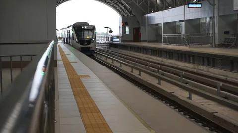 Palembang Light Rail Transit Arriving at Elevated Station, Indonesia Stock Footage 116652445