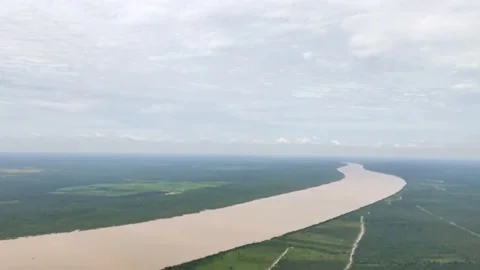 Palembang's Musi River which is synonymous with brown water Stockbeeldmateriaal 232415655
