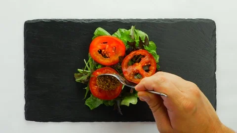 Paleo pumpkin burger assembling and serving Stockbeeldmateriaal 108091797